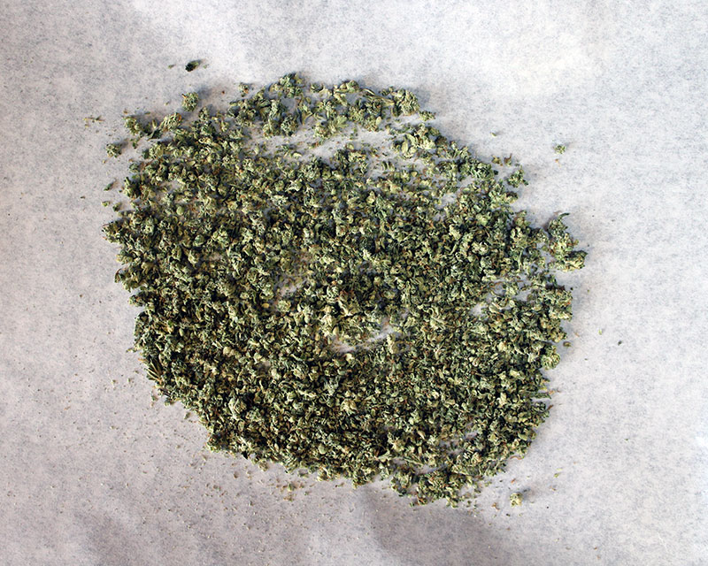 Spread cannabis on baking sheet
